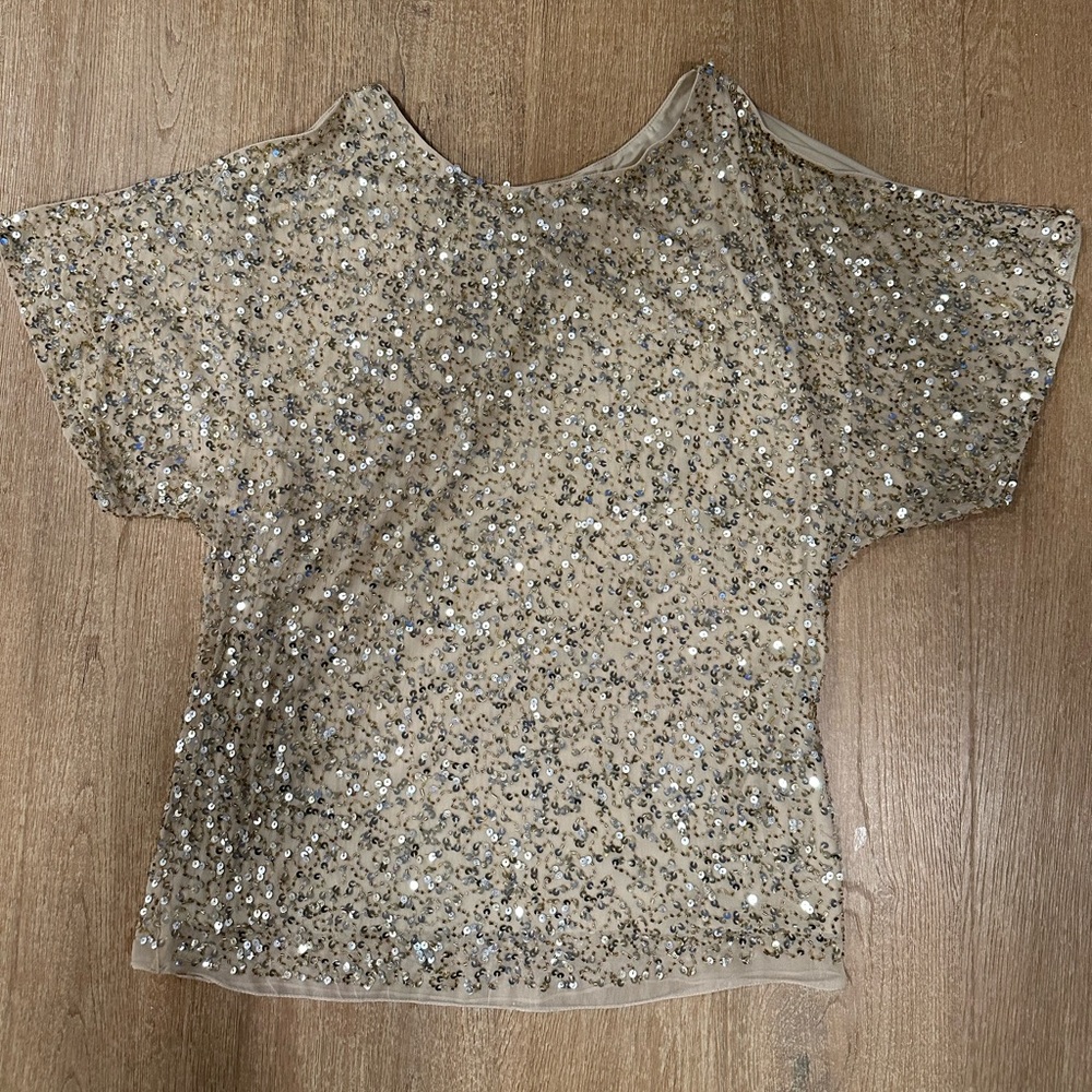Ladies gold sequence top. Medium. New with tags.Never worn
